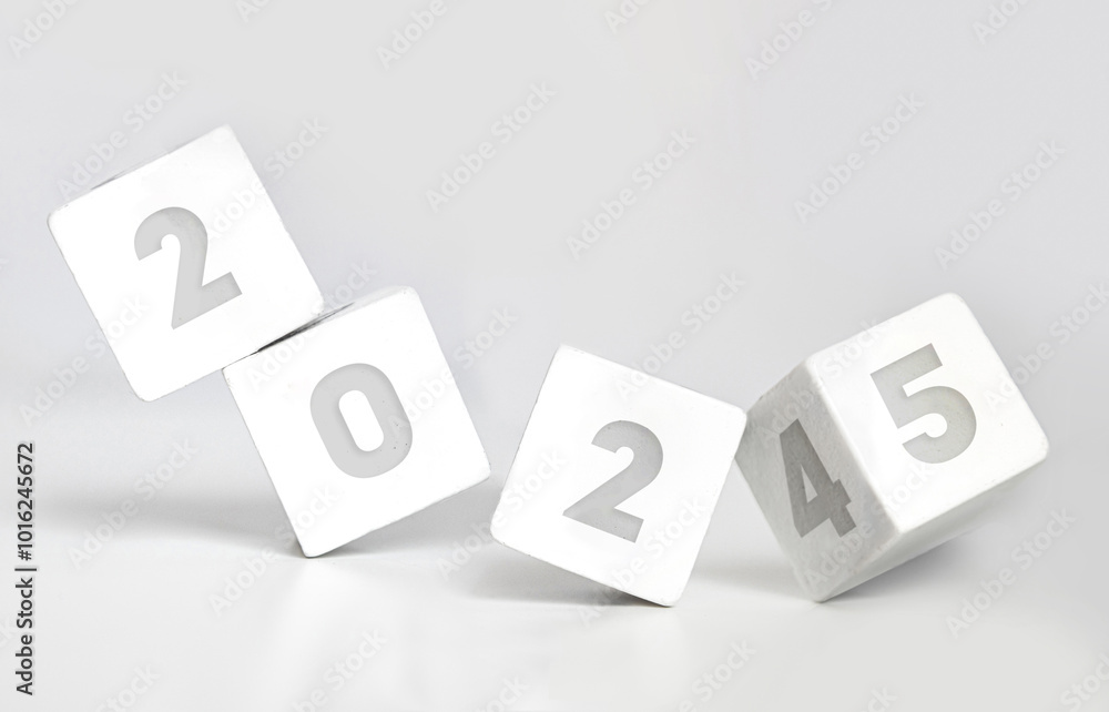White cube block flipping from 2024 to 2025 on white background White cube block flipping from 2024 to 2025 on white background