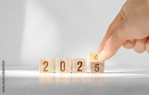 Wooden cubes change from 2024 to 2025 new year, plan and goal photo