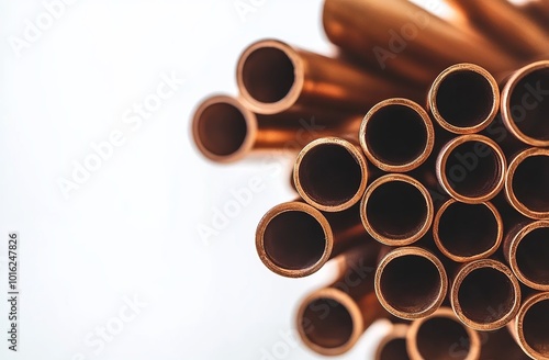 A stack of copper pipes on white background, stock photo for marketing and advertising use, professional photography style, high resolution, high quality, high detail, sharp focus, no blur effect.