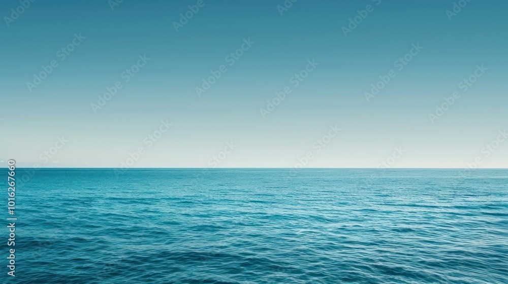 Obraz premium Calm Ocean Water Under a Clear Blue Sky