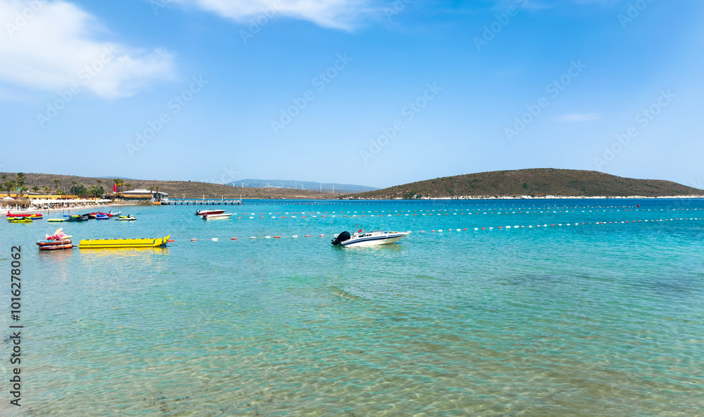 Obraz premium Beautiful bay in Aegean Sea with speed boats