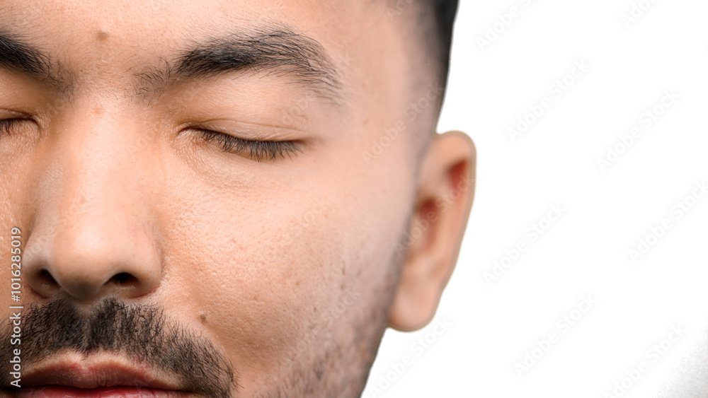 Fototapeta premium Man's eyes, close-up, on a white background