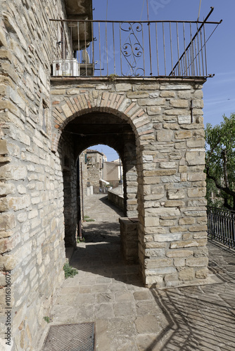 A small street among the old houses of a Guardia Perticara, small town in Basilicata, Italy. photo