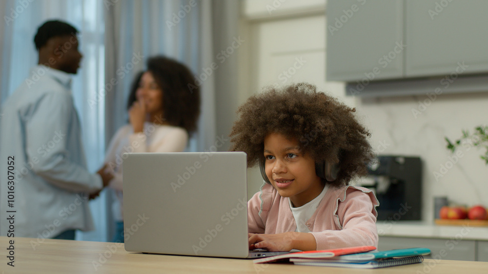 African American little girl pupil daughter child kid studying learning at home kitchen e-learning study with laptop computer online lesson parents mother father talk together parental control family African American little girl pupil daughter child kid studying learning at home kitchen e-learning study with laptop computer online lesson parents mother father talk together parental control family
