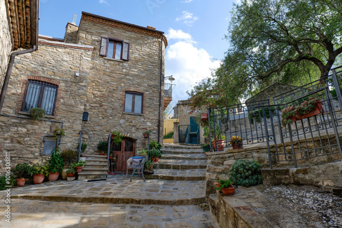 A small street among the old houses of a Guardia Perticara, small town in Basilicata, Italy. photo