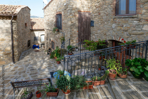 A small street among the old houses of a Guardia Perticara, small town in Basilicata, Italy. photo