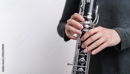 Person playing oboe, white isolate background