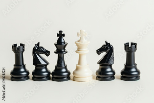 Chess Set. High Angle View of Plastic Chess Pieces on Light Background