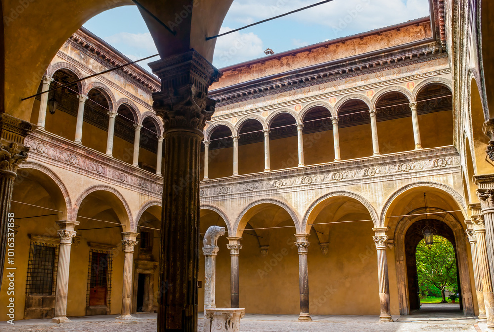The courtyard of Palazzo Bevilacqua Ariosti with small drinking fountain in the middle in Bologna, Italy