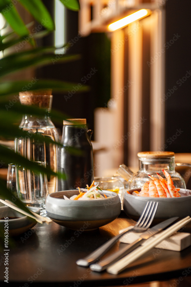 Shrimp sashimi on a plate on a table in a sushi bar. Shrimp sashimi on a plate on a table in a sushi bar.