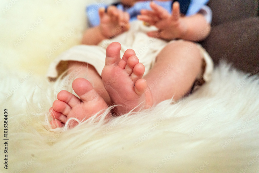 Close-up of a newborn baby's feet lying on cosy faux fur Close-up of a newborn baby's feet lying on cosy faux fur