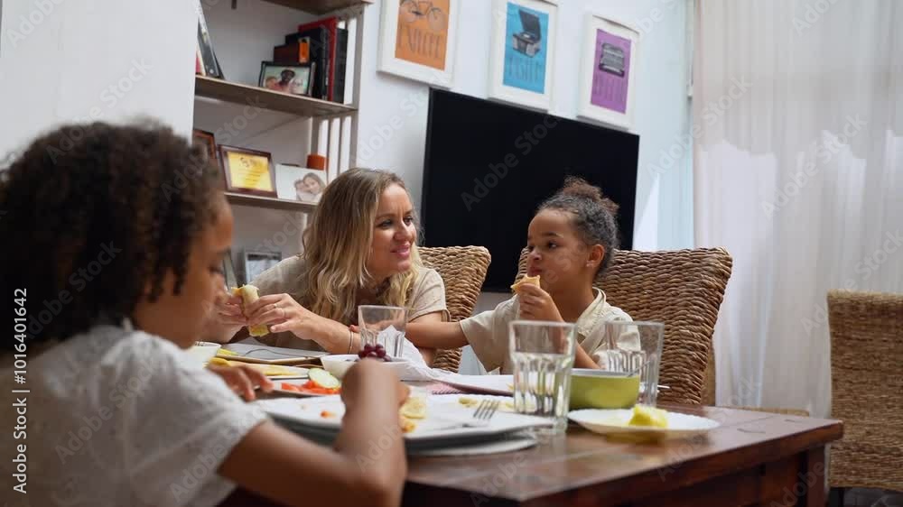 Happy diverse parents and children African-American Caucasian eating weekend lunch breakfast together. Family tradition, healthy food for children, leisure activity, care and relationships Happy diverse parents and children African-American Caucasian eating weekend lunch breakfast together. Family tradition, healthy food for children, leisure activity, care and relationships