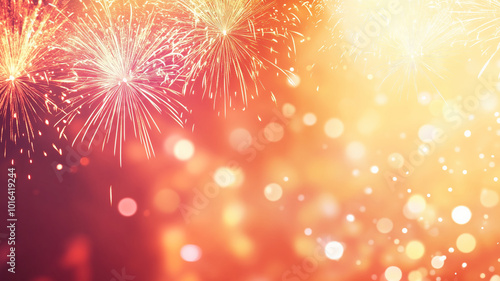 Festive fireworks against a bright golden-orange bokeh background.