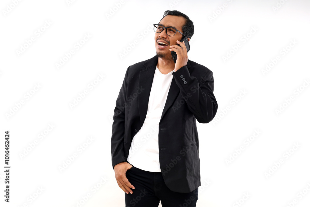 Asian businessman standing and calling on mobile phone. Isolated on white background Asian businessman standing and calling on mobile phone. Isolated on white background