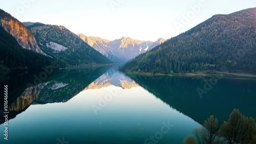 Wallpaper Mural Horizontal video footage, view from a hotel window of tall snowy rocky mountains, coniferous forest, and river Torontodigital.ca