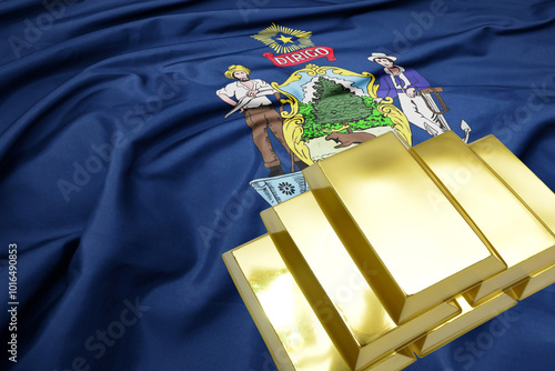 shining golden bullions on the maine state flag background. gold reserves. photo