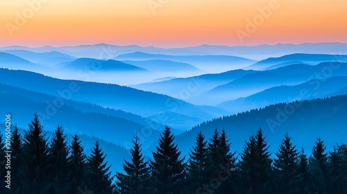 Misty Mountain Range at Sunrise with Silhouetted Pine Trees