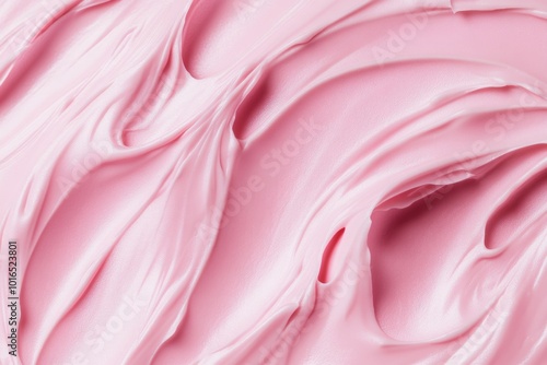 A close-up shot of pink frosting on a table, perfect for food and dessert-related concepts. photo