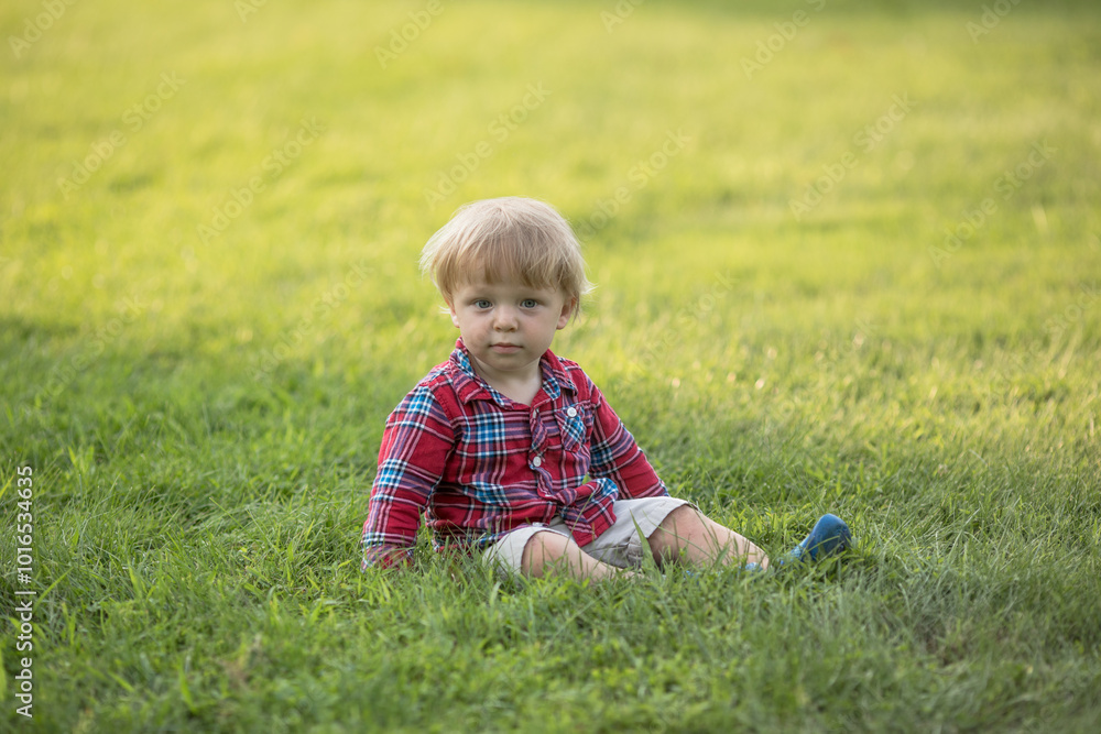 portrait of happy baby boy in the park portrait of happy baby boy in the park