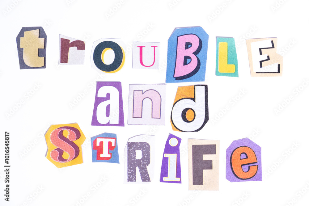 Phrase Trouble and Strife spelled in cut out newspaper style typography isolated on white background. Phrase Trouble and Strife spelled in cut out newspaper style typography isolated on white background.