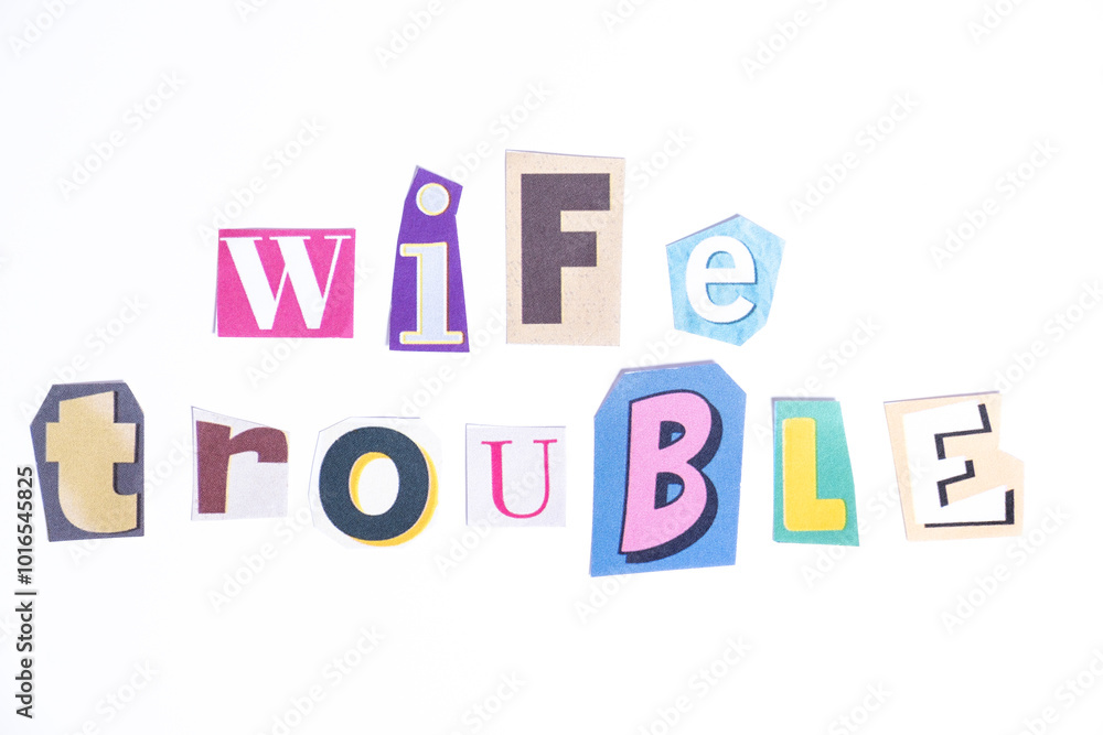 Phrase Wife Trouble spelled in cut out newspaper style typography isolated on white background.