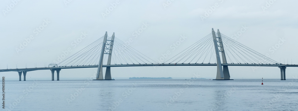 distant bridge over foggy bay on rainy day distant bridge over foggy bay on rainy day