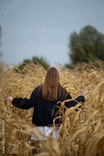 woman in the field whis no visible face 