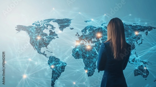 A woman in a business suit observing a digital world map with illuminated connections symbolizing global communication and international business networks.