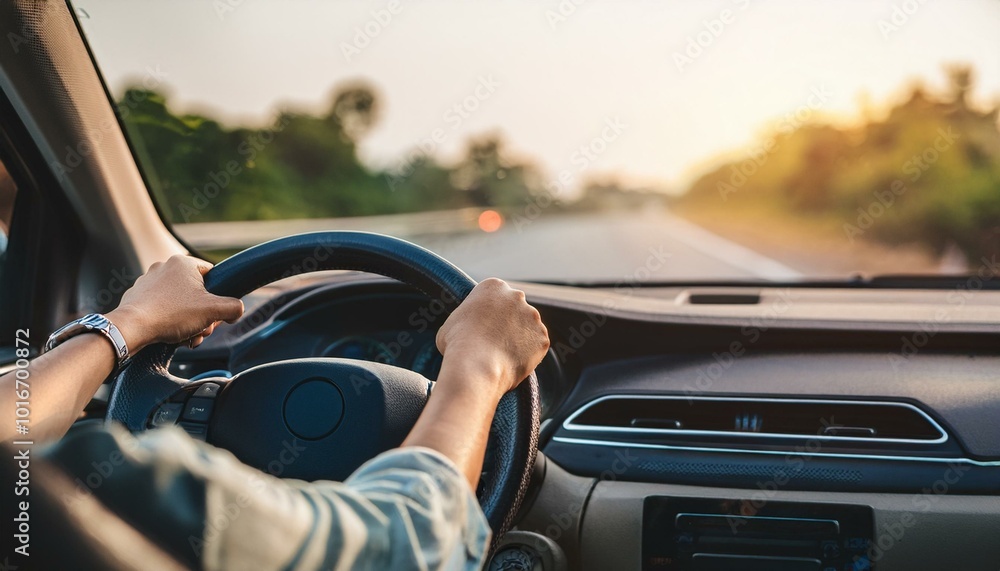 hands of car driver on steering wheel hands of car driver on steering wheel