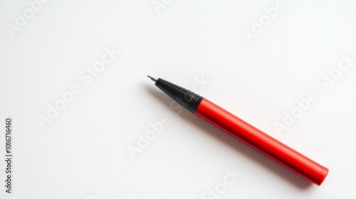 A red pen isolated on a white background, perfect for branding and educational design concepts. Vibrant and minimalistic stationery image.