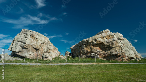 Big Rock (aka Okotoks Erratic or, by the Blackfoot Indians, as Okotok) is a 16,500-tonne (18,200-ton) boulder that is about the size of a two-story house and lies to the south and west of Okotoks, AB. photo