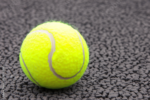 A man playing tennis asphalt on a road. playing sport concept. a man playing tennis on asphalt on green in grey. a man playing tennis on asphalt with greens and balls in grey lifestyle.