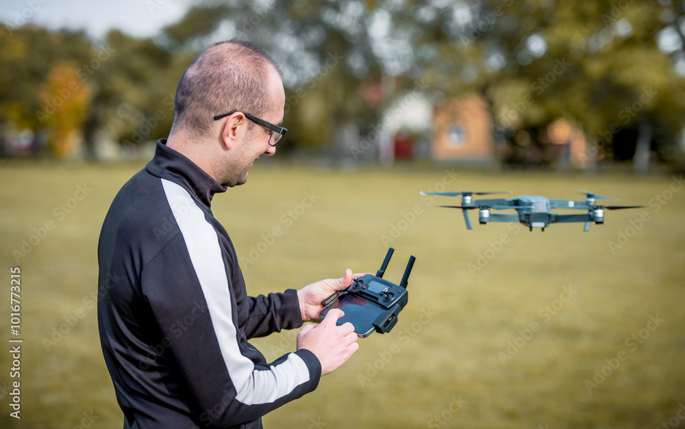 Man with flying drone. Concept of cybernetics and robotics Man with flying drone. Concept of cybernetics and robotics