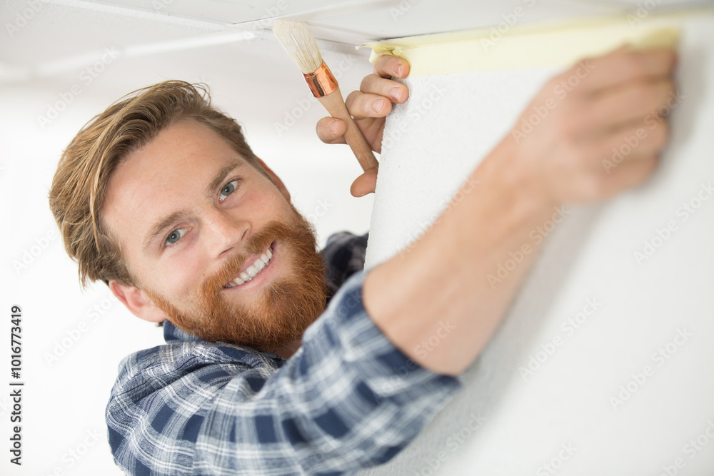 man painting ceiling with white color man painting ceiling with white color