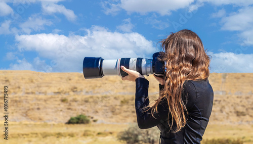woman taking nature photo, wildlife photographer with camera, bird photography, adventure travel lifestyle background