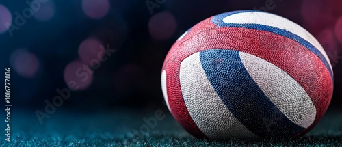  A tight shot of a red, white, and blue spherical object against a verdant backdrop, with indistinctive lights hazy in the distance