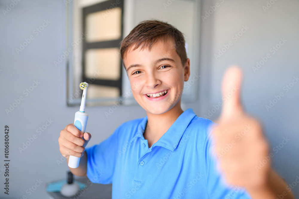 child brushes his teeth and smiles on a blue background child brushes his teeth and smiles on a blue background
