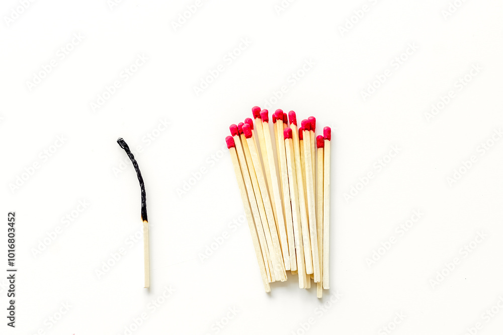 Symbol of danger with matches on white background top view Symbol of danger with matches on white background top view