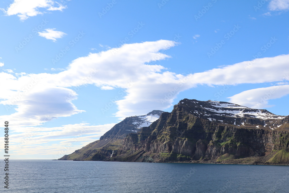 sheer cliffs and high stark mountain landscape on the icelanding east coast sheer cliffs and high stark mountain landscape on the icelanding east coast