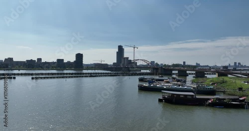 Schellingwouderbrug and the newly constructed Amsterdam Sluisbuurt on Zeeburgereiland, Amsterdam. Aerial drone video photo