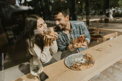 Enjoying delicious pizza to...