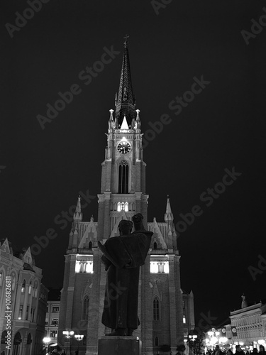 Monument of Svetozar Miletić: Nighttime View of the Cathedral in Novi Sad’s Town Square 10. 5. 2024. Vojvodina region Serbia photo