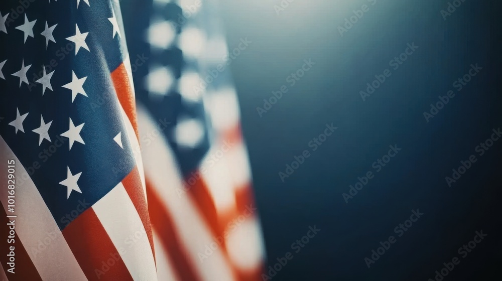 Multiple usa flags are positioned in the foreground with a dark and ...