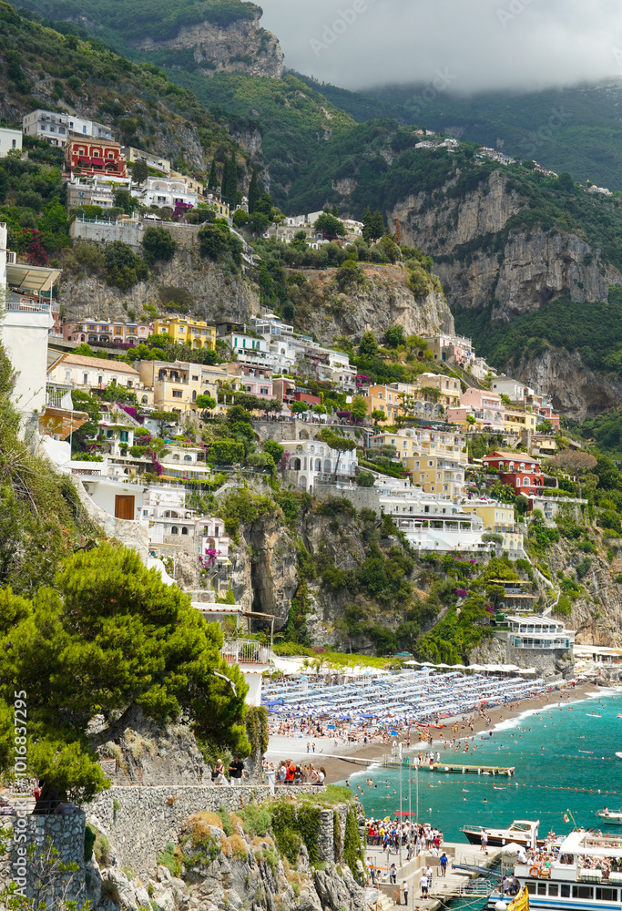 Amazing view of the coast of Positano, Italy. Positano is a city located on the famous Amalfi coast. The houses are built on the mountain and have all kinds of colors. Amazing view of the coast of Positano, Italy. Positano is a city located on the famous Amalfi coast. The houses are built on the mountain and have all kinds of colors.