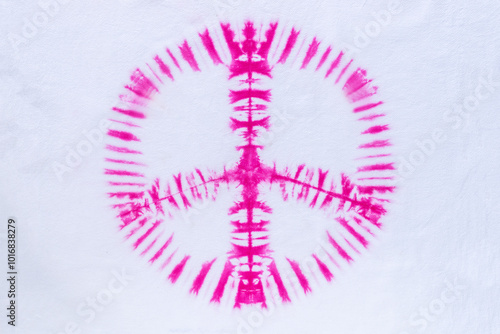 pink peace sign tie dye pattern hand dye on cotton fabric texture background. photo