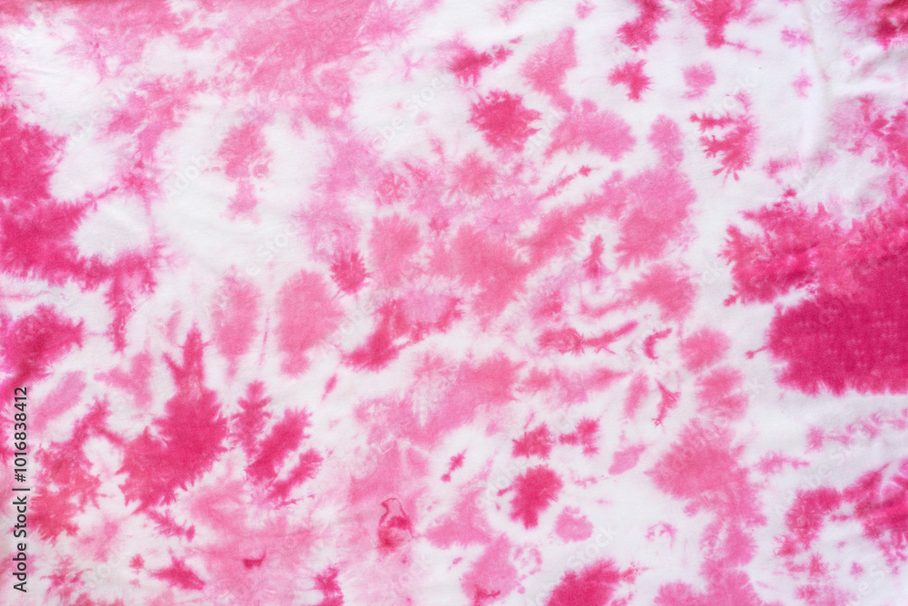 Fototapeta premium pink tie dye pattern hand dyed on cotton fabric abstract background.