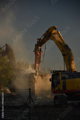 demolition of the bridge with construction equipment