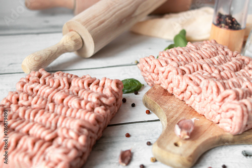 Raw minced meat , ingredients for cooking. on wooden background. photo