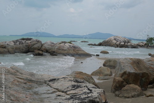 Bangka. Belitung. Bali. Indonesia. Beautiful beach view with large rocks, white sandy beach and rocky formations against bright blue sky, rugged nature