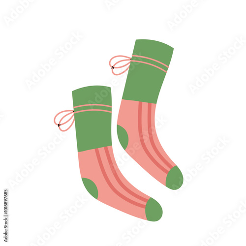 Warm green and pink socks isolated on white background. Autumn and winter cozy season. Accessorize. Christmas and New Year time.